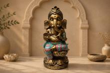 FIGURA RESINA GANESHA SENTADA CON ROPA TONOS AZULES Y ROJOS 33X14CM. FIGURA RESINA GANESHA SENTADA CON ROPA TONOS AZULES Y ROJOS 33X14CM.